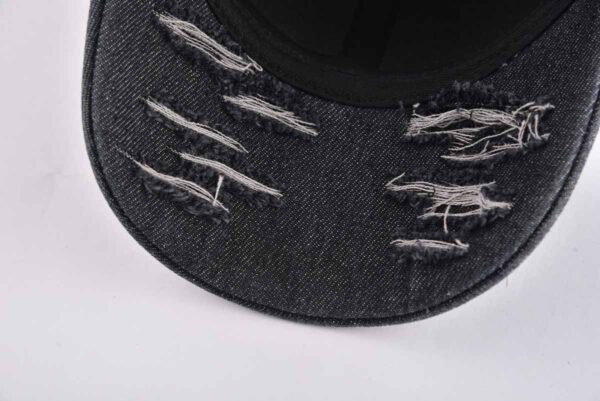 the ripped denim on the lower brim of the mens fashion baseball cap KN2012212