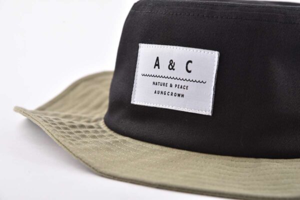 Aung Crown outdoor bucket hat with a woven label on the front KN2012211