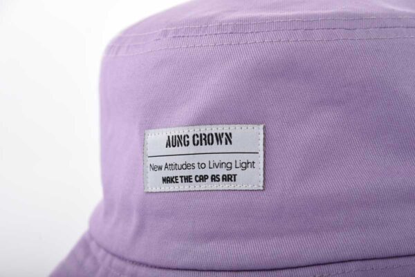 Aung Crown purple woven bucket hat with a woven label on the front SFA-210406-1