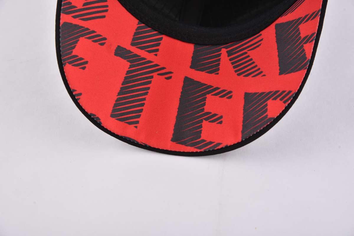 Streeter black curved brim trucker hat with a red lower brim KN2012141 Streeter black curved brim trucker hat with a red lower brim KN2012141