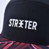 Streeter casual 6-panel black and red trucker hat with a rubber patch on the front KN20112701