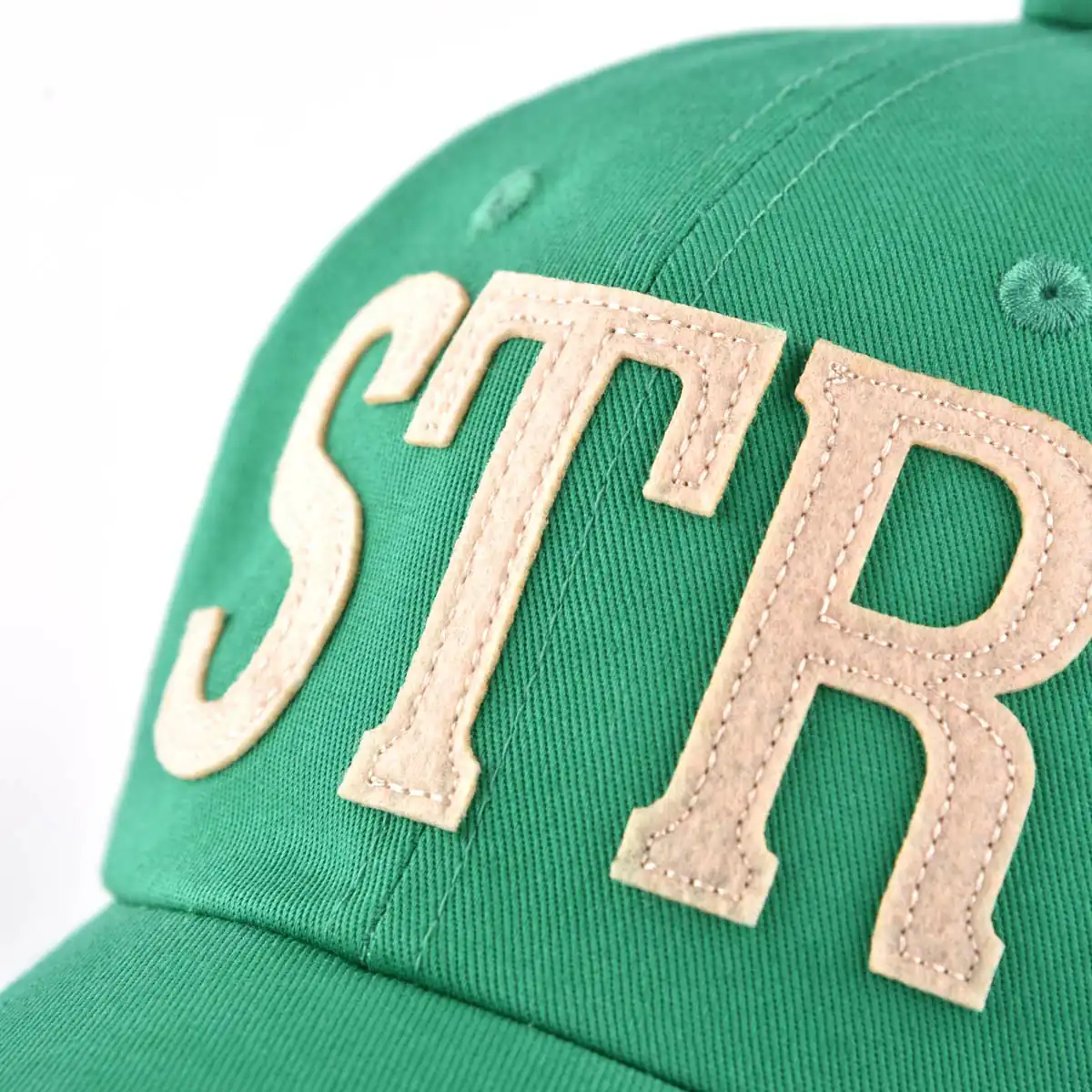 the embroidery felt patch on the green baseball cap KN2012242